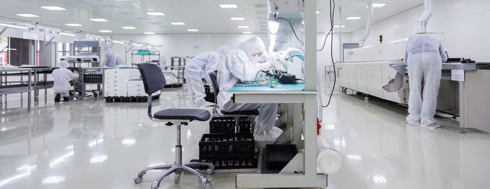 Workers assembling electronics on a manufacturing line in Vietnam