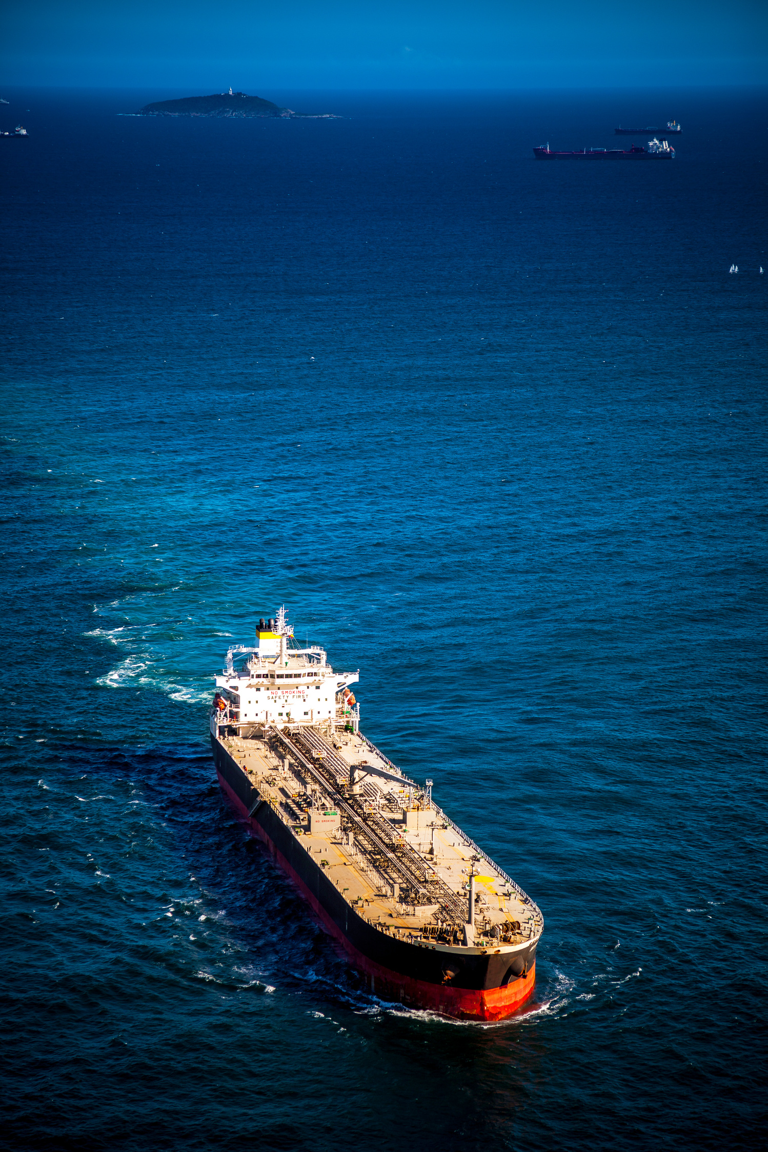An oil tanker crossing open water near a contested maritime shipping lane